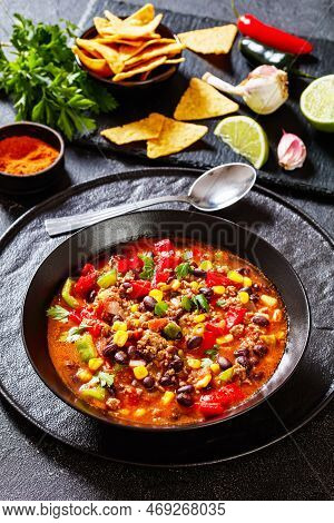 Taco Soup Of Ground Beef, Tomatoes, Chopped Green Chilis, Onions, Corn, Red Beans And Taco Seasoning