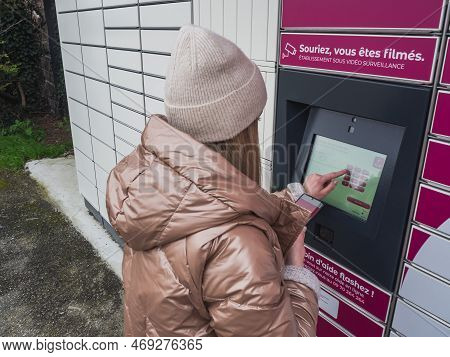 Loriol Sur Drome, France - January 14, 2023: Picking Up A Parcel From A Mondial `relay Locker By A Y