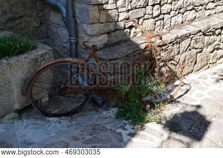 Rust Abandoned Old Bicycle In Vintage Street Rusty Bike In Outdoor Alley City