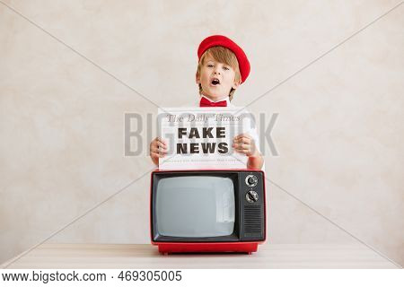 Newsboy Shouting Against Grunge Wall Background. Boy Selling Fake News
