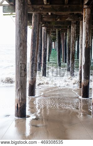 Exterior Shot Of The Wooden Support Structure That Carries The Sea Cliff Pier Near Aptos, California