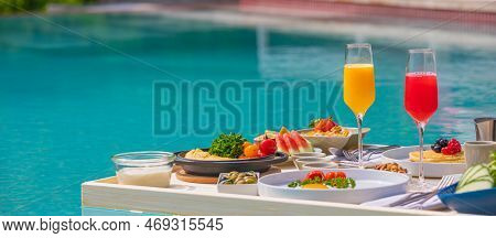 Breakfast In Swimming Pool, Floating Breakfast In Luxurious Tropical Resort. Table Relaxing On Calm 