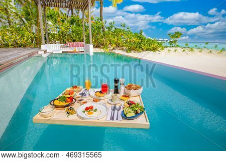 Breakfast In Swimming Pool, Floating Breakfast In Luxurious Tropical Resort. Table Relaxing On Calm 