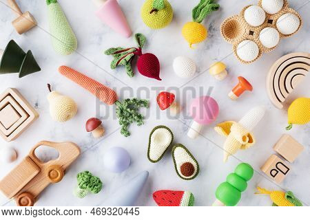 Hep Of Wooden And Knitting Eco Toys For Baby Activity, Motor And Sensory Development On White Table 