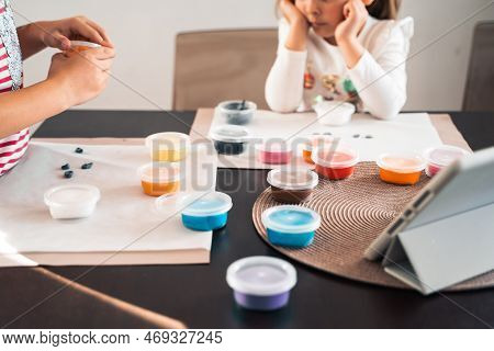 Little Girls Sculpt Figurines Crafts From Air Plasticine, Modeling Dough.online Lessons In Tablet. C