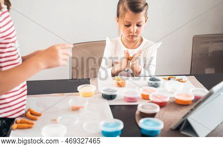 Little Girls Sculpt Figurines Crafts From Air Plasticine, Modeling Dough.online Lessons In Tablet. C