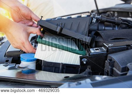 Replacing A New Air Filter In A Passenger Car, Engine Compartment. Car Maintenance. Automotive Mecha