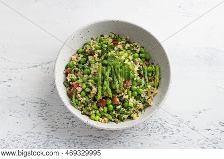 Traditional Middle Eastern Or Arabic Tabbouleh Salad Of Bulgur, Tomatoes, Asparagus, Green Peas And 