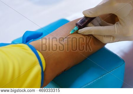 Nurse Collecting A Blood From Patient In Hospital