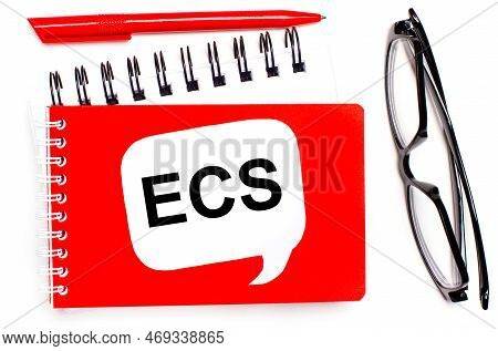 On A White Background, White And Red Notepads, Black Glasses, A Red Pen And A White Card With The Te