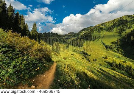 Summer Trail In The Kimasar Gorge With A View Of Mount Furmanov. Popular Weekend Hiking Route In Alm