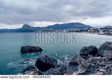 View On Coast Of The Black Sea Of Sudak From Cape Alchak In Cloudy Weather In Spring. Crimea