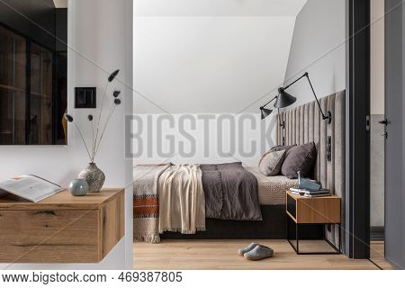 Crearive Composition Of Bedroom Interior With Velvet Bed, Shelf, Design Lamp, Bedroom Textiles And E