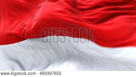 The Indonesia National Flag Waving In The Wind. The Republic Of Indonesia Is A State Of Southeast As