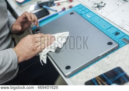 Close-up Of Specialized Manual Cleaning Of Laptop, Screen, Notebook, Keyboard, Case, From Dust. Clea