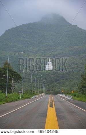 White Buddha Statue On The Mountain In Wat Thep Phithak Punnaram Temple Nakhon Ratchasima.