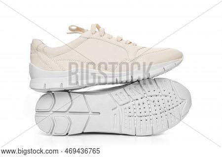 Leather Sneakers With Lacing And Perforated Sole On A White Background.