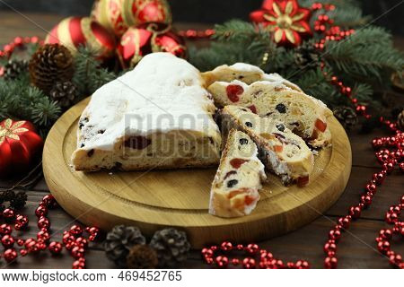 Traditional Stollen With Decoration On Wooden Background
