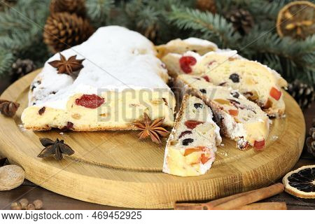 Traditional Stollen With Decoration On Wooden Background