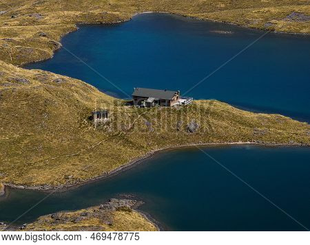 Scenic Mountain Panorama Of Idyllic Alpine Angelus Hut On Lake Shore In Nelson Lakes National Park T