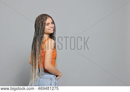 Beautiful Woman With Long African Braids On Grey Background, Space For Text