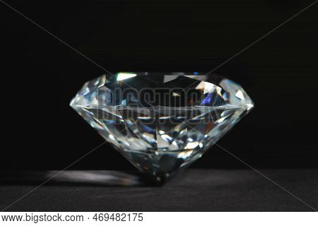 Beautiful Dazzling Diamond On Dark Background, Closeup. Precious Gemstone