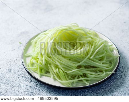 Zucchini Noodles On Plate. Vegetable Noodles - Green Zoodles Or Courgette Spaghetti On Plate Over Gr