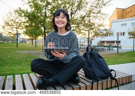 Young Asian Girl, Student Sits On Bench, Graphic Designer With Pencil And Digital Tablet Draws Scatc