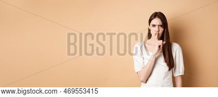 Angry Young Girl Scolding Bad Behavious, Shushing And Frowning Mad, Tell To Be Quiet, Looking Disple