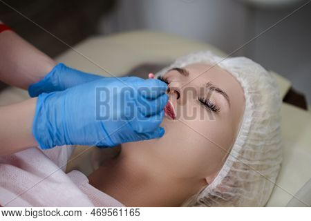 Closeup Of Lips Of Woman Having Permanent Lips Makeup At Beauty Salon During Permanent Makeup Tattoo