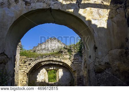Ruins Of Ancient Building Against Blue Sky. Collapsed Ceiling. Masonry, Room With Arched Vaults In C