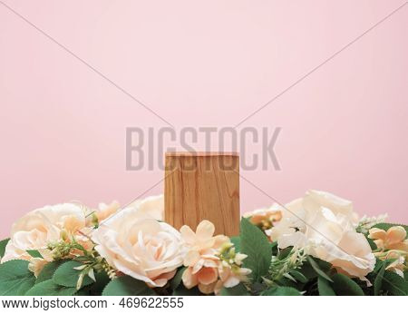 Wood Podium Beige Rose Flowers On Pink Pastel Background With Space.beauty Cosmetic Skin Care Advert