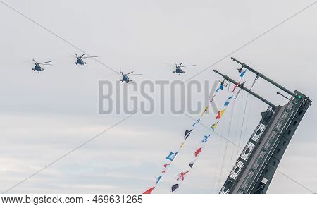 July 31, 2022, St. Petersburg, Russia. Mil Mi-8 Multi-purpose Helicopters And A Divorced Bridge Span