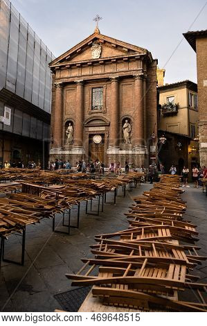 Siena, Italy - August 15 2022: Preparations For The Contrada Dinner Of The Civetta Or Little Owl Con
