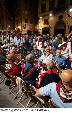 Siena, Italy - August 15 2022: The Grand Contrada Dinner Of The Civetta Or Little Owl Contrada On Th