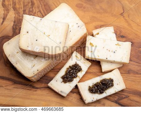 Italian Cheese Collection, Yellow Taleggio Cheese With Black Truffles Mushrooms