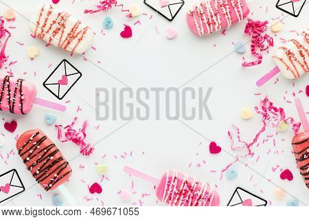 Flatlay Collage Of Valentine Cakesicles And Assorted Decorations In A Border.