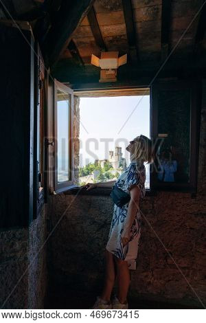 Young Beautiful Woman Visits The Sights Of The Republic Of San Marino, Italy
