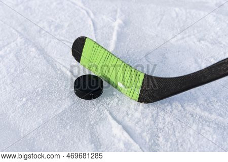 Children\'s Hockey Stick Rewound With Electrical Tape. Hockey Game. Hitting The Puck