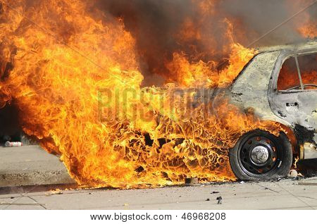 Burning police car.