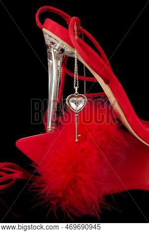 Sexy, Red Strappy High Heel Shoes With Box On A Black Background