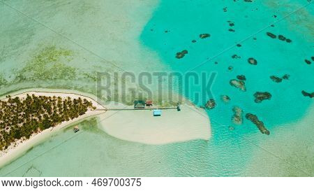 Seascape With Beautiful Beach And Tropical Island Surrounded By A Coral Reef From Above. Onok Island