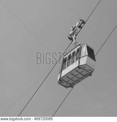 Cableway Cabin Against Sky And Chalk Cliff. Rosh Hanikra, Mediterranean, Israel. Black And White Sty