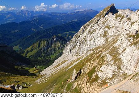 Landscape With A Mountain In The Foreground And Long Ranges Of Mountain Ranges In The Background Aga