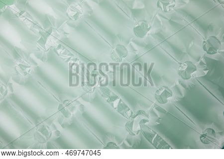 Background For Design. Textured Green Wrap For The Safe Packaging Of Fragile Parcels. Non-degradable