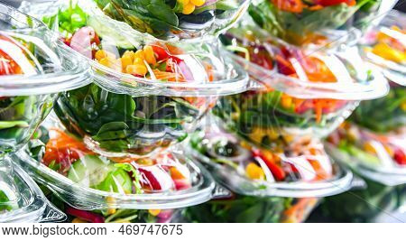 Plastic Boxes With Pre-packaged Vegetable Salads, Put Up For Sale In A Commercial Refrigerator