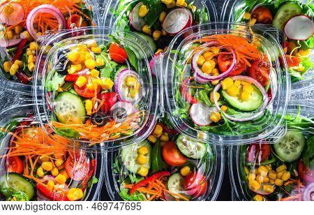 Boxes With Pre-packaged Vegetable Salads In A Commercial Fridge