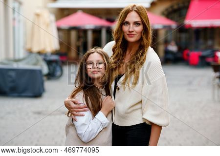 Young Mother And School Preteen Girl Making Walk In The City. Happy Family, Woman And Daughter With 