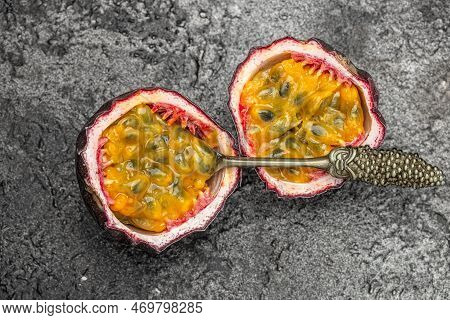 Passion Fruits On Dark Background. Set Of Whole And Half Of Fresh Passion Fruit. Place For Text, Top