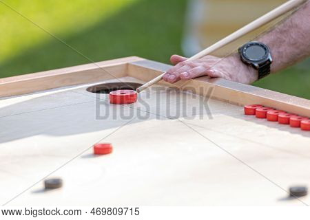 Men Playing Novuss Game. Novuss Is A National Sport In Latvia Similar To Pocket Billiards Or Pool.